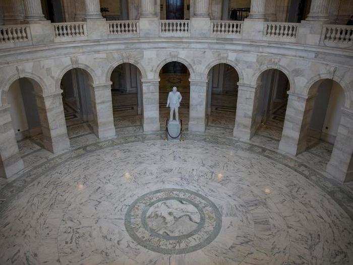 The Russell Rotunda at the US Capitol building is eerily desolate.