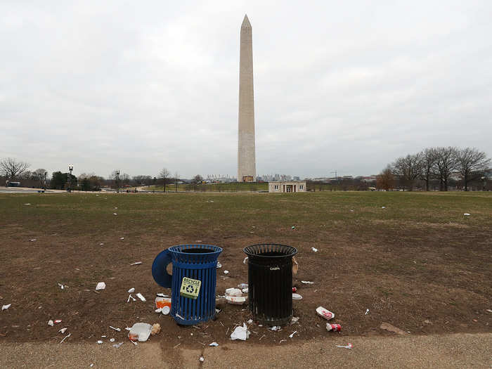 Litter remains scattered near the base of the Washington Monument.