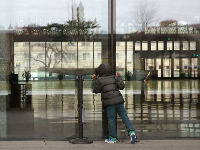 A seven-year-old boy peered inside the museum to catch a glimpse.