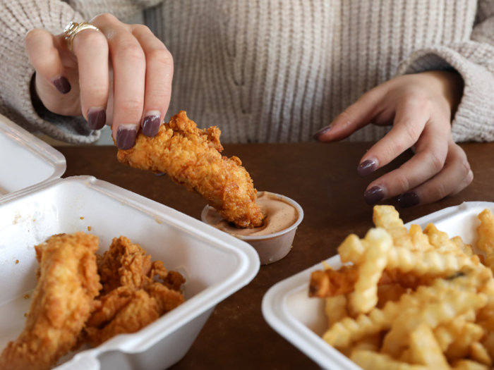 Without the buns to shield them, the pieces were very greasy. The chicken finger combo came with a container of the Cane