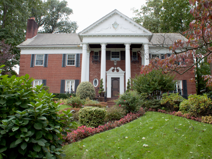 It was much larger than the other house, with a brick exterior and white columns flanking the entrance. The front yard was perfectly landscaped.