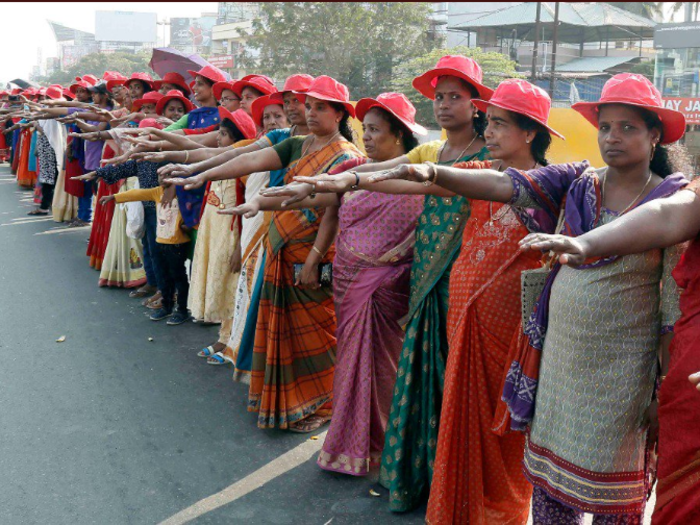 During the assembly, the women stood by each other stretching the line through National highway 66, with several women wearing ‘kasavu mundu’-- a traditional dress.