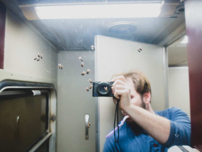 The bathroom was about as pleasant an experience as you might imagine. Turning on the lights woke up the dozen flies that had taken up residence on the mirror.