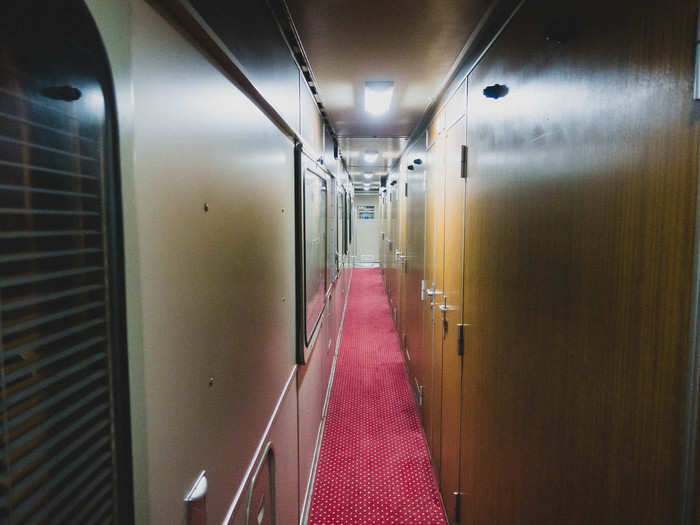 A dapper attendant checked our tickets and guided us onboard.The carriage was simple with thin wood paneling and red carpet. It smelled faintly of Nescafe and Cleopatra cigarettes.