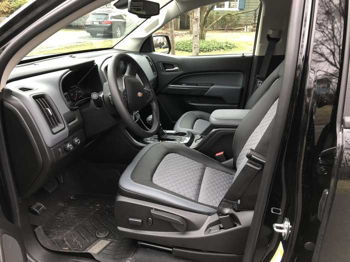 The black interior is nothing fancy. The seats are comfortable, but the synthetic upholstery and heavy-duty floor mats are intended to endure abuse. The seats are heated, a nice touch.