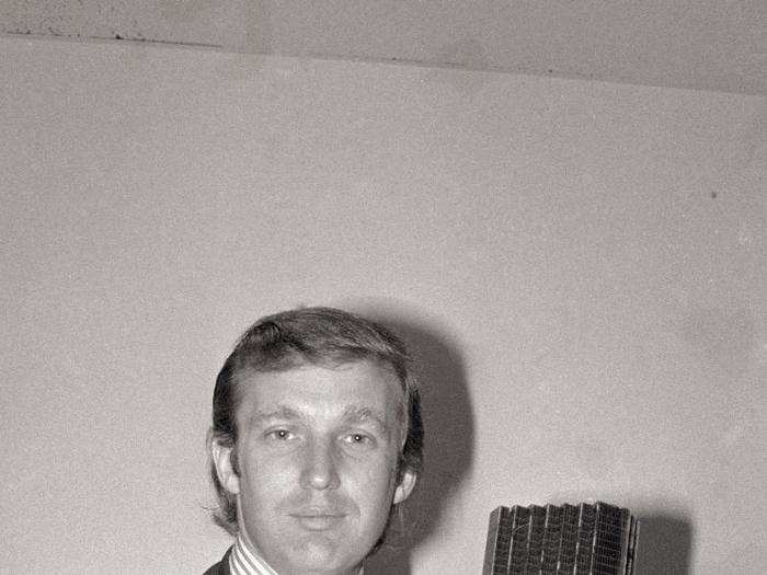 33-year-old Donald Trump holds a model of the Fifth Avenue tower that became Trump Tower.