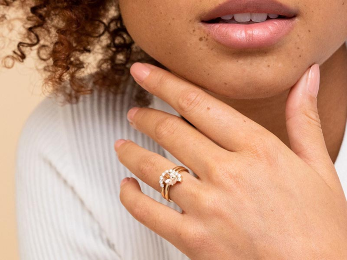 A round cut peach morganite ring that is best accentuated by a rounded crown band