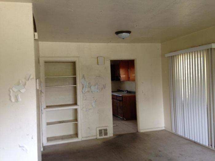 Many of the homes have peeling walls and rusted appliances.