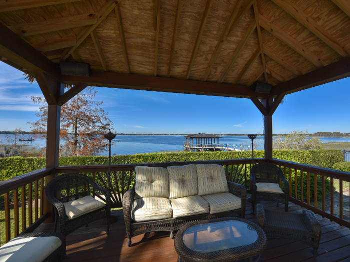 A tiki-style cabana overlooks the lake.