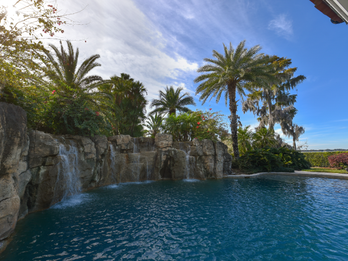 A waterfall flows into the pool ...