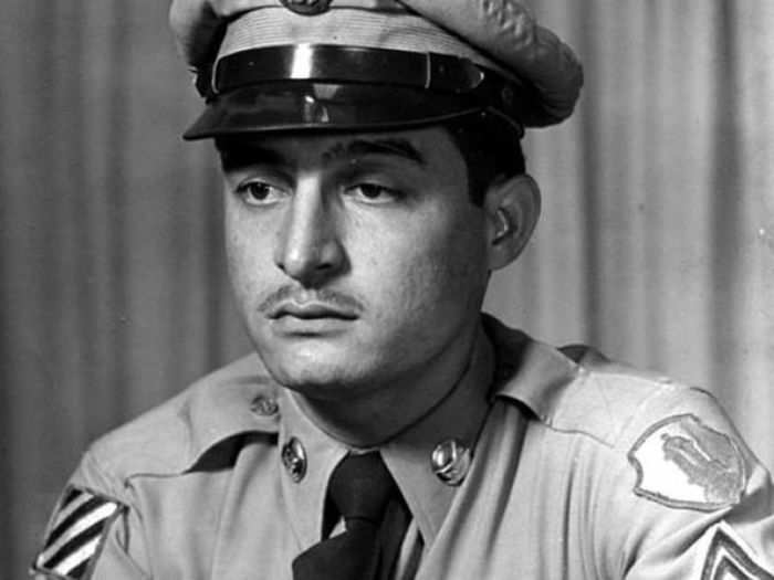 Sgt. Juan Negron remained in an exposed position through the night so his unit could launch a counterattack against enemy fighters in Kalma-Eri, North Korea.