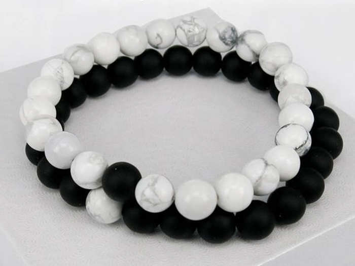 A simple yin yang bracelet set to remind them how well they balance each other out