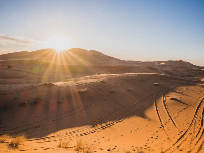 As we approached camp, the sun was dipping behind the highest dunes, making the already burnt-orange sand even more golden.