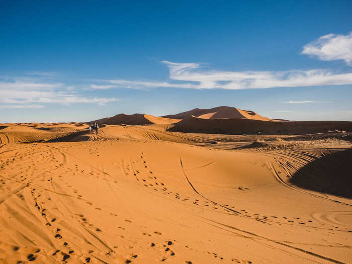 My drive, Eder, had warned me on the way to the dunes not to expect them to be smooth and perfect. It had been many months since a sandstorm, the usual way the dunes get "cleaned," he said.