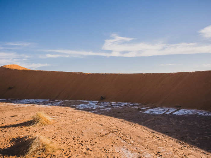 At first, I thought that white material in the shade of the dune was frost. The desert gets notoriously cold at night, particularly because I visited in January. On closer inspection, I saw that it was white rocks.