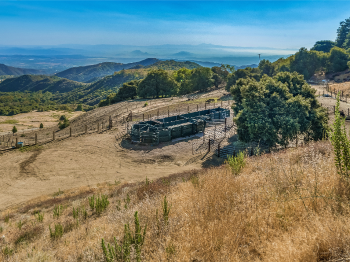 Adjacent to the mountaintop home is a fully-functional buffalo ranch that comes with two barns and a one-bedroom, one-bathroom caretaker