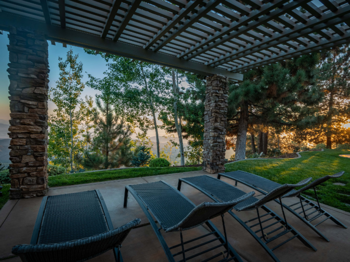 Another patio has lounge chairs that look out over the mountain landscape.