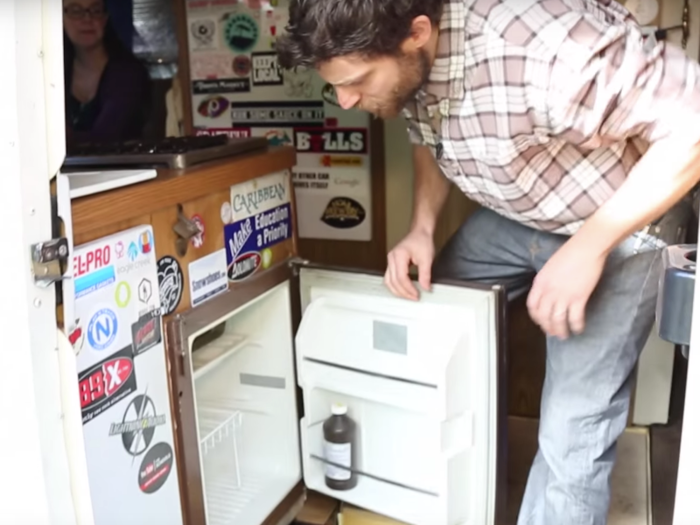 The couple kept a mini fridge in their small kitchen...