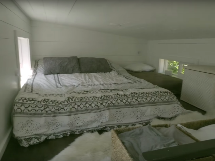 The couple has a lofted sleeping nook, with another loft opposite them in the house for their son as he gets older...