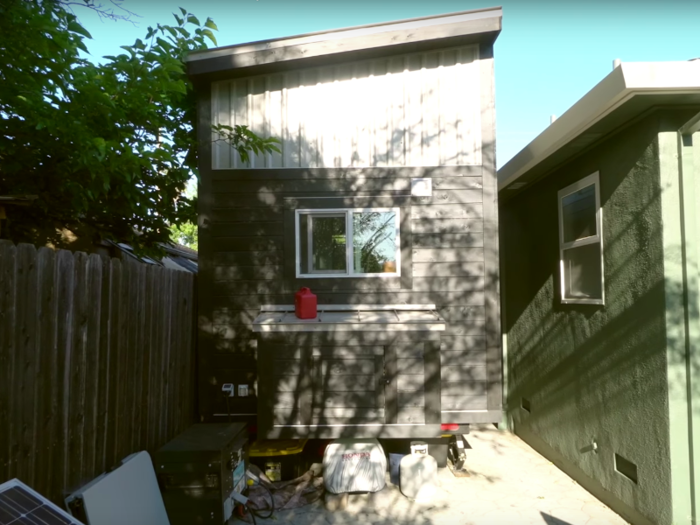 They use an extension chord to stay hooked up to the house for power, and they also keep a generator outside for when they want to use the air conditioner or washer and dryer.