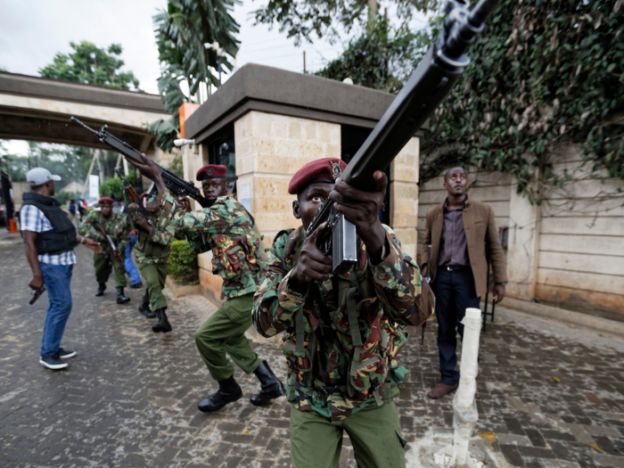 Kenyan security forces aimed their weapons upward toward one of the buildings at the complex.