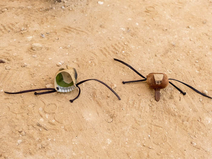 The decorative leather hoods are known as burqas. The birds are so used to visual stimuli that when their eyes are covered, they assume they must be safe. While I sat in Al-Hamli