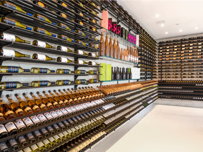 There are two fully stocked Champagne and wine cellars ...