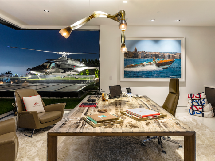 The home comes fully furnished and stocked with art. A penthouse office on the upper level has a view of the helipad (not functional) and the purely decorative helicopter. The helicopter is not functional, but it was refinished with a luxury interior.