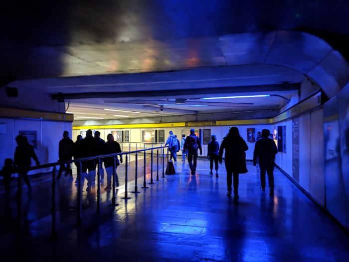 At La Raza, a light tunnel is filled with educational posters about the history of the earth.