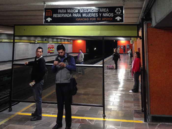 Two cars are always reserved for women and children. At busy stations, a police officer was present to make sure no one accidentally boards in the wrong section.