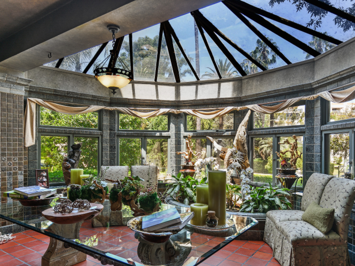 One light-filled room has skylights and wall-to-wall windows. When the Alis lived there, Mrs. Ali reportedly kept a dozen exotic birds in an aviary in the home.