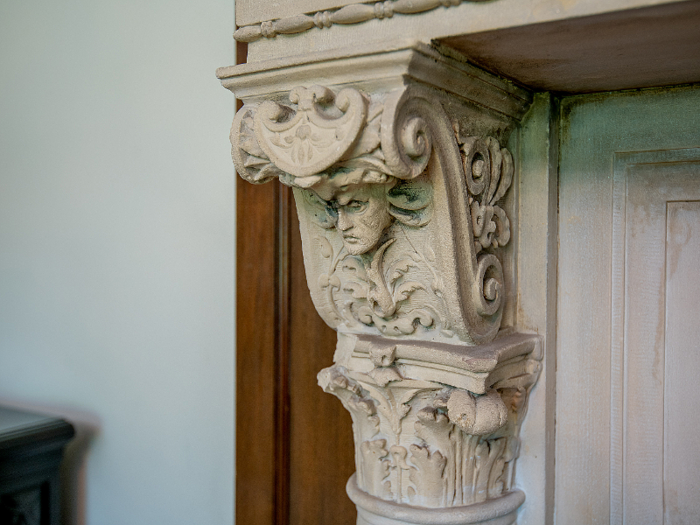 ... and the original fireplaces with ornate details.