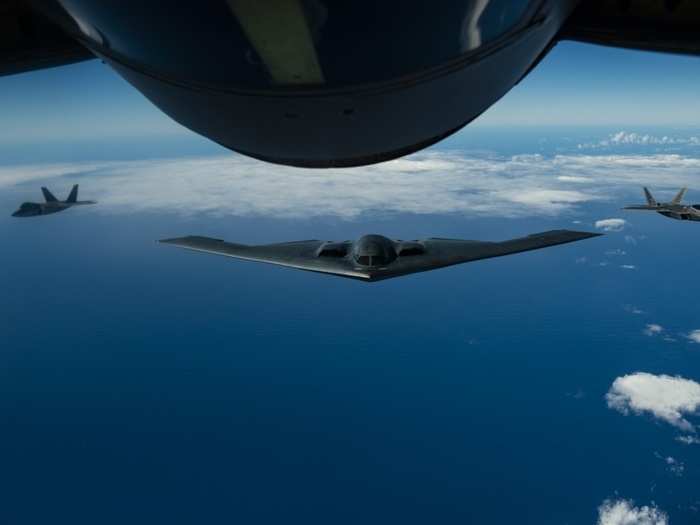 Together, a B-2 accompanied by a pair of F-22s could kick in an enemy