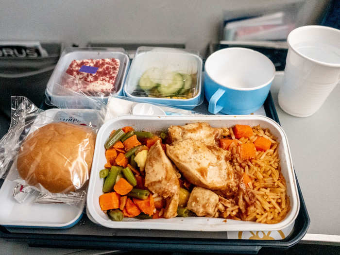 The in-flight meal was very good. The rice was moist and tasty with lots of flavor and the chicken had a spiced brown sauce on it.