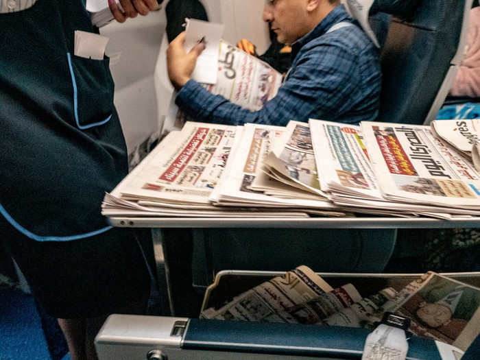 Shortly after take-off, a flight attendant came around to offer up newspapers in a variety of different languages. It