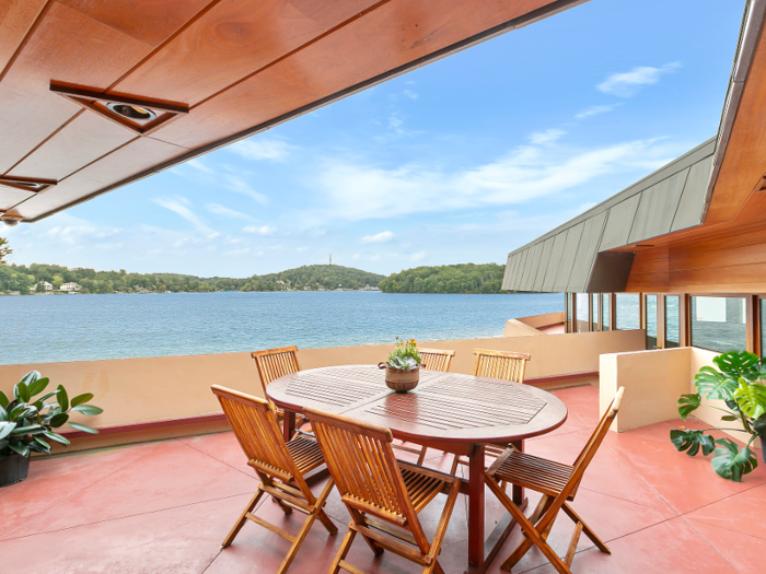 Outside, expansive living areas allow al fresco dining ...