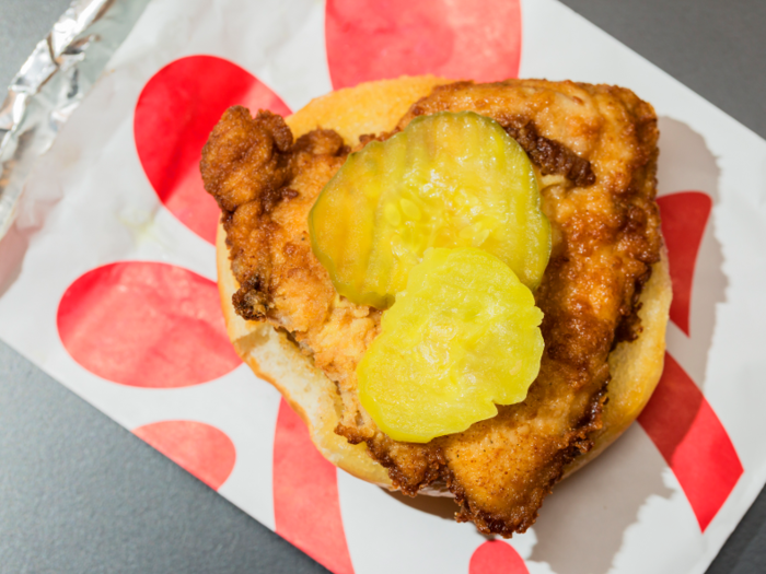 After the pickles have been carefully placed on the heel of the bun — yep, they use "heel" and "crown" to describe the buns as well — it