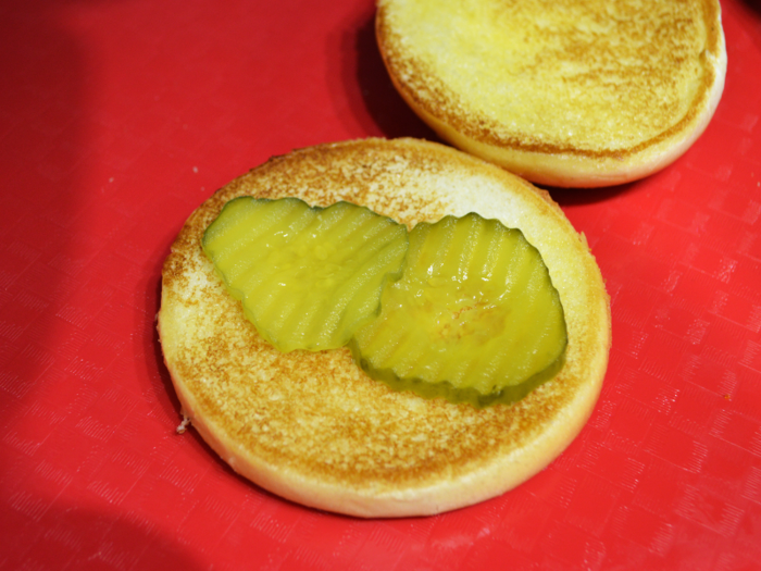 The pickles have to be touching, but not quite overlapping, and need to be placed in a way that allows them to cover the maximum amount of surface area. This placement is ideal.