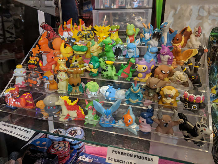 Below the counter, an array of adorable little Pokémon figurines tempts customers with a last-minute impulse purchase. Just $4 each, or would you prefer three for $10?