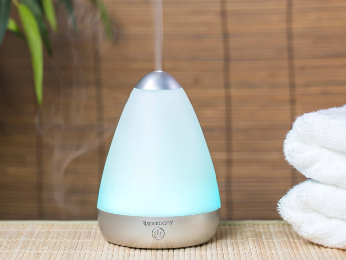 An essential oil diffuser to set the mood