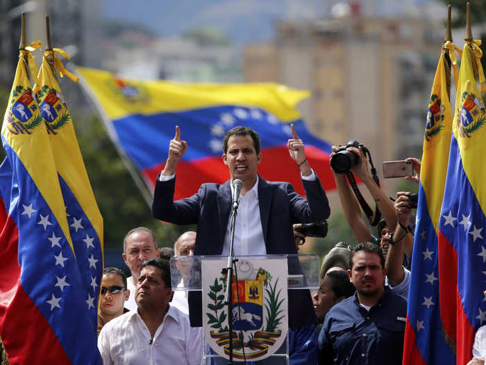 What is the opposition strategy in reaching out to the armed forces and Maduro