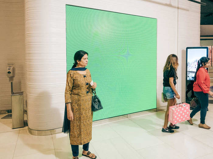 After going through security, a photographer takes a photo of you in front of a green screen, which I can only assume they later superimpose with the Burj Khalifa. I can understand wanting a photo of yourself at the top of the tower, but who wants a green-screened portrait? What