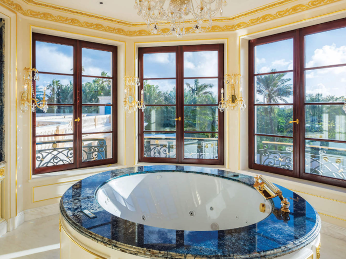 Each bathroom features a round Jacuzzi tub ...