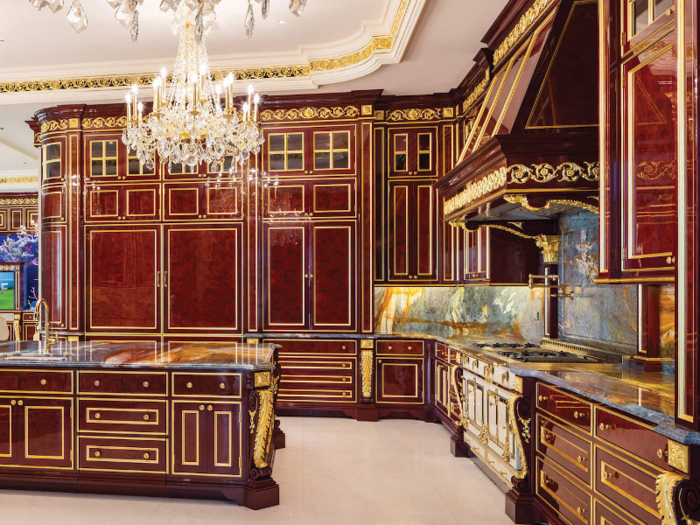 It features mahogany cabinets and gold leaf gilding.