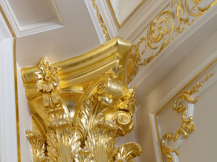 The crown molding is also gilded in 22-karat gold.