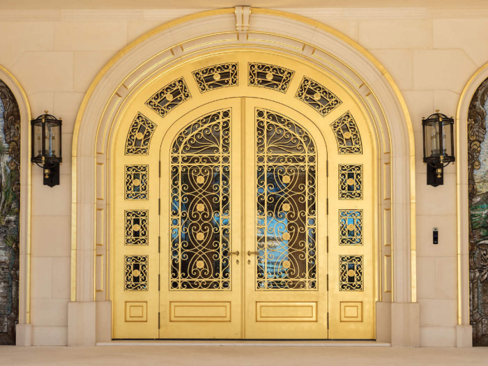 The doors are embossed with 22-karat gold and are 12 feet high.