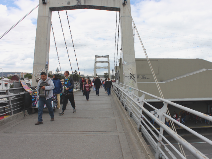 As an alternative to crossing hectic streets with crosswalks, Bogotá has lots of suspended passenger bridges over major roadways. They look like this.