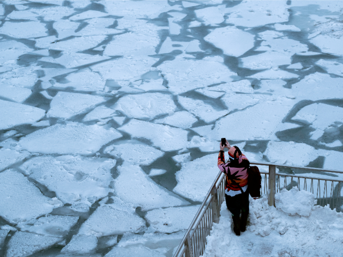 Ice floes float on the Chicago River, which winds through the city.