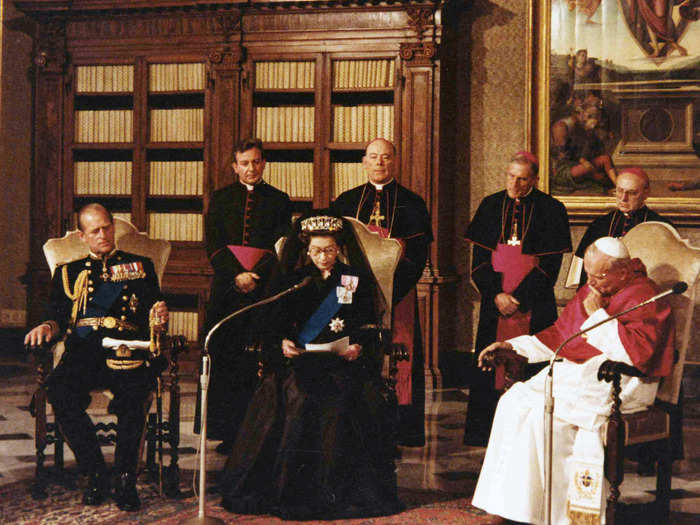 1980: It was in 1980 that the queen visited the Vatican for the first time. Here, she talks to Pope John Paul II while her husband looks on.