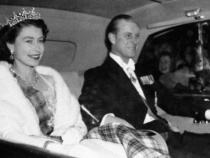 1955: The queen plays a key role in maintaining diplomatic relationships with other countries. Here, she arrives by car at the Portuguese Embassy in London